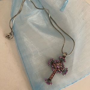 Cross pendant with stones.